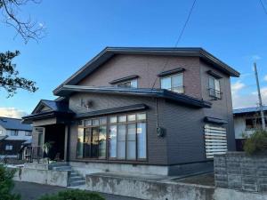 青森市　K様邸　外壁金属サイディングカバー工事
